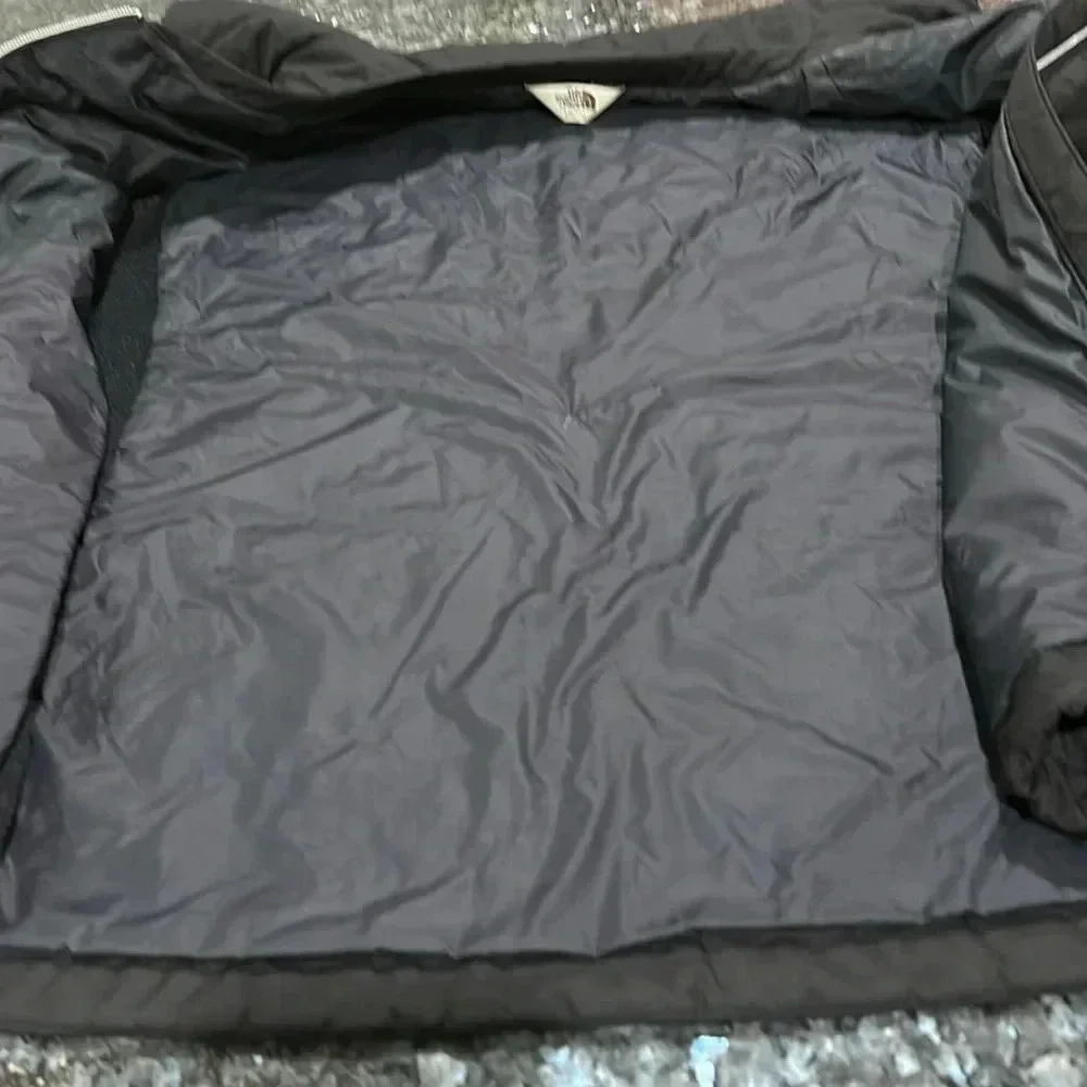 The North Face black puffer vest full front zip, pockets, front and back logo